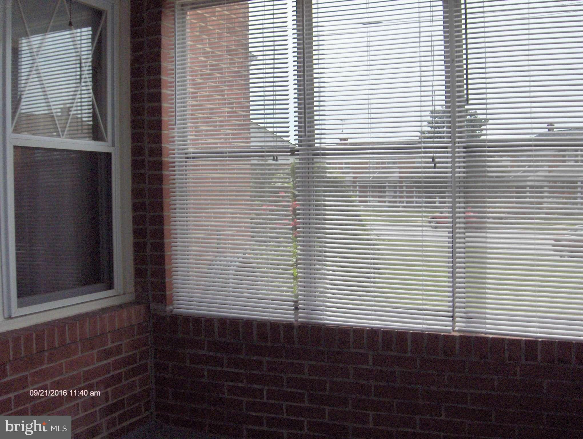 8069 Wallace Road Baltimore, MD 21222 - Photo 21 of 30 Enclosed front porch