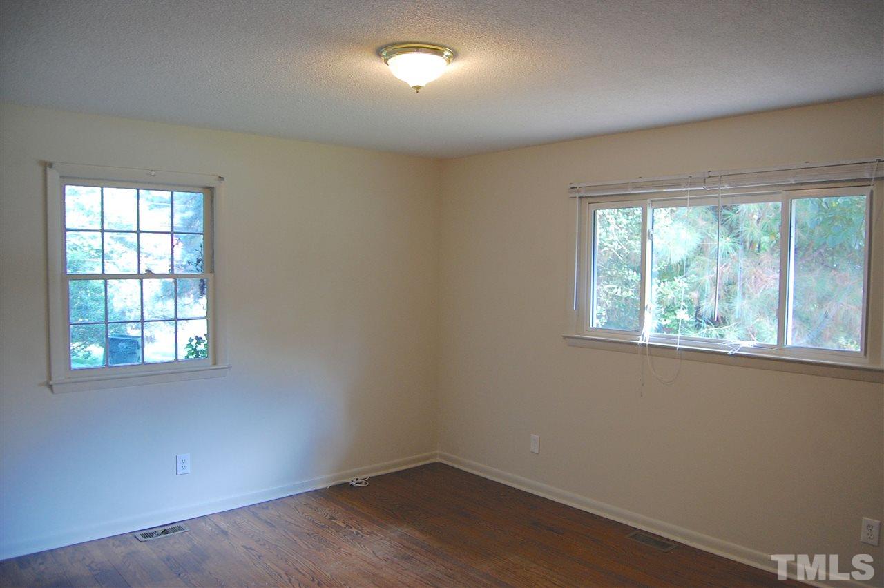 1009 Somerset Road Raleigh, NC 27610 - Photo 3 of 13 an empty room with a window