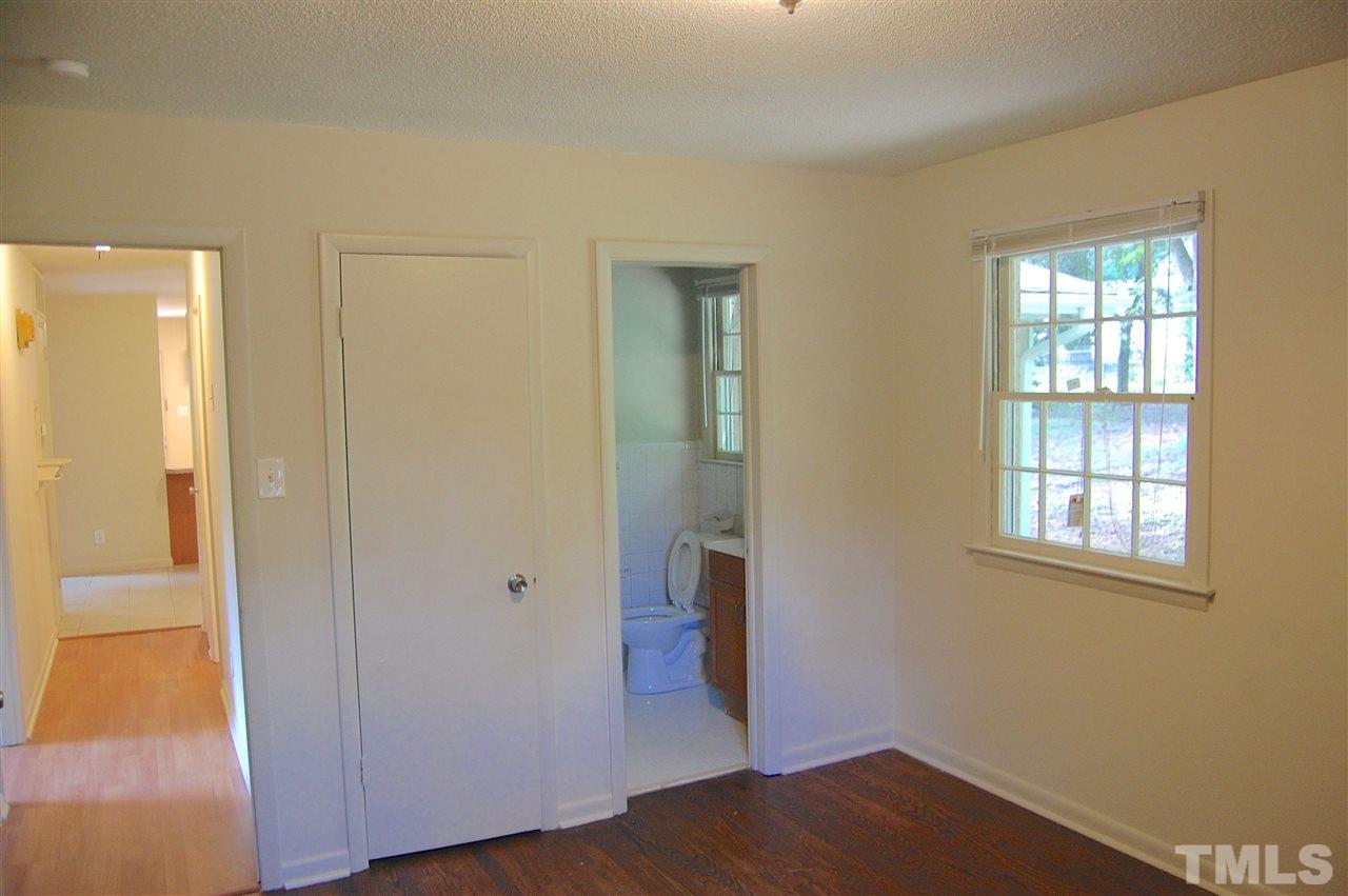 1009 Somerset Road Raleigh, NC 27610 - Photo 4 of 13 an empty room with windows