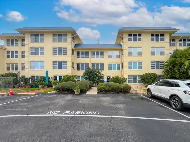 a view of a parked cars in front of a building
