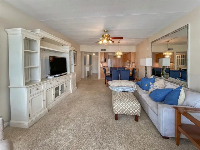 a living room with furniture and flat screen tv