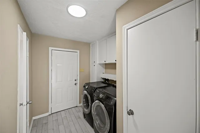 a view of a storage & utility room with washer and dryer