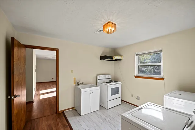 a view of a storage & utility room with a window