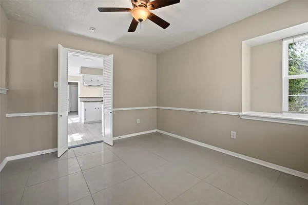 a view of an empty room with a window
