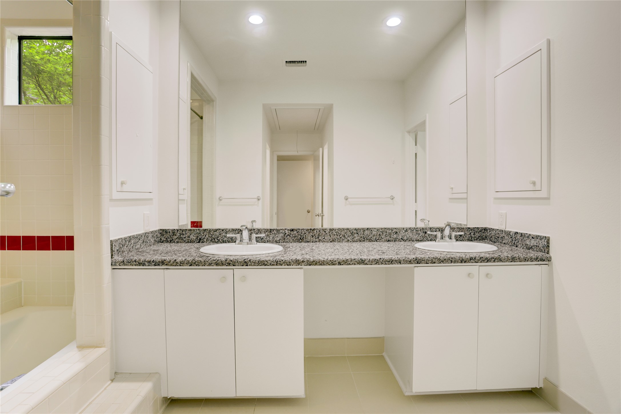 2629 Wroxton Road, Unit A Houston, TX 77005 - Photo 13 of 22 The primary bathroom combines style and practicality with double sinks.