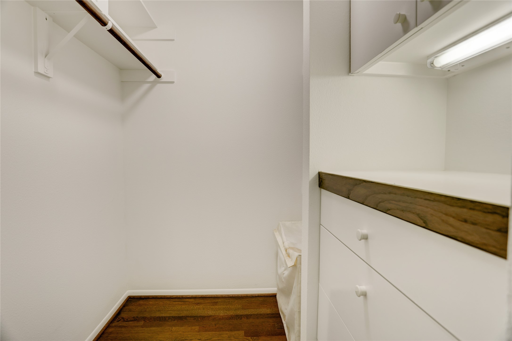 2629 Wroxton Road, Unit A Houston, TX 77005 - Photo 15 of 22 Built-in drawers elevate the functionality of this walk-in closet.