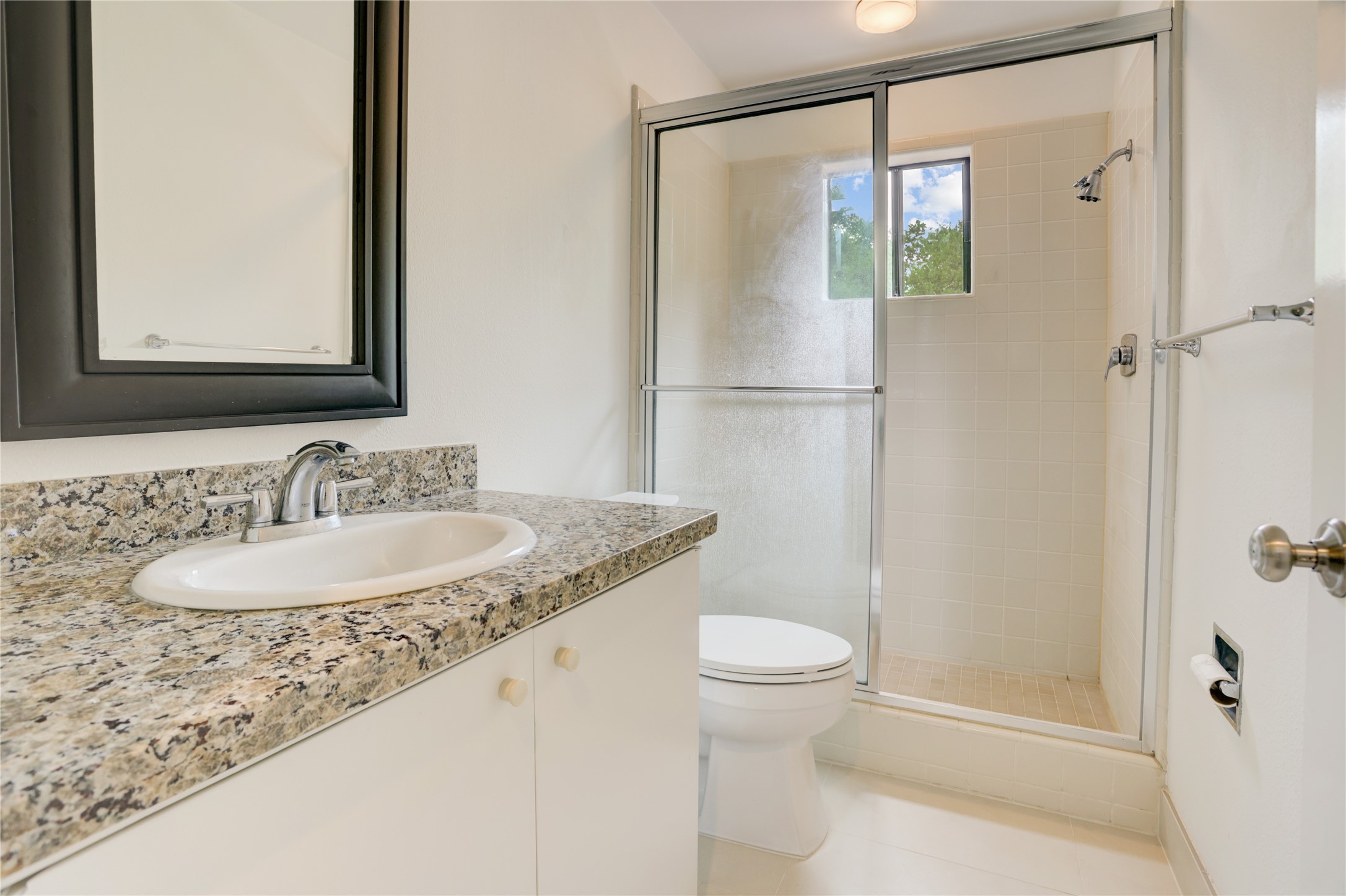2629 Wroxton Road, Unit A Houston, TX 77005 - Photo 18 of 22 The secondary bathroom offers comfort and convenience for daily use.
