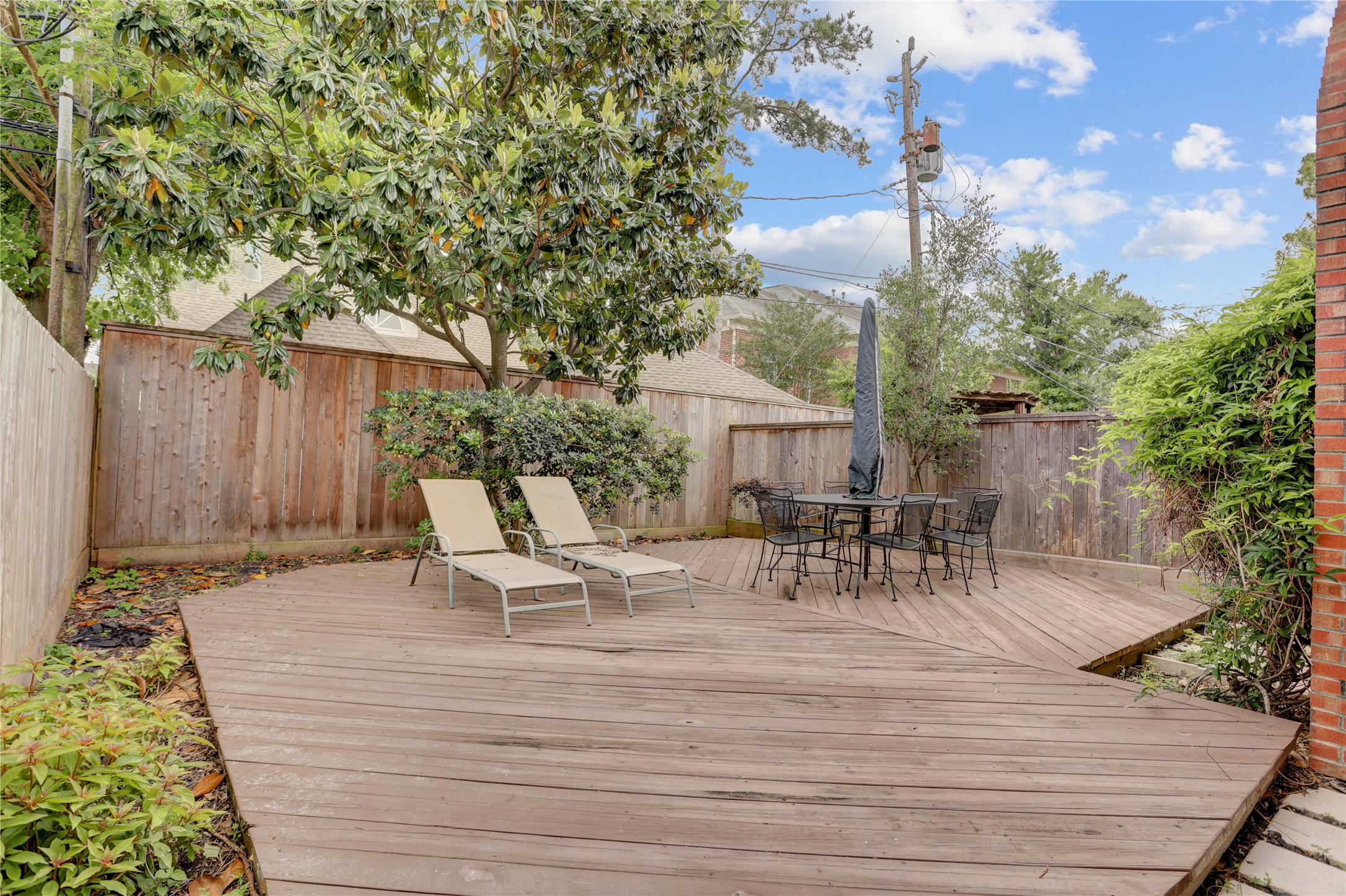 2629 Wroxton Road, Unit A Houston, TX 77005 - Photo 19 of 22 A beautifully designed patio ideal for gatherings and quiet moments.