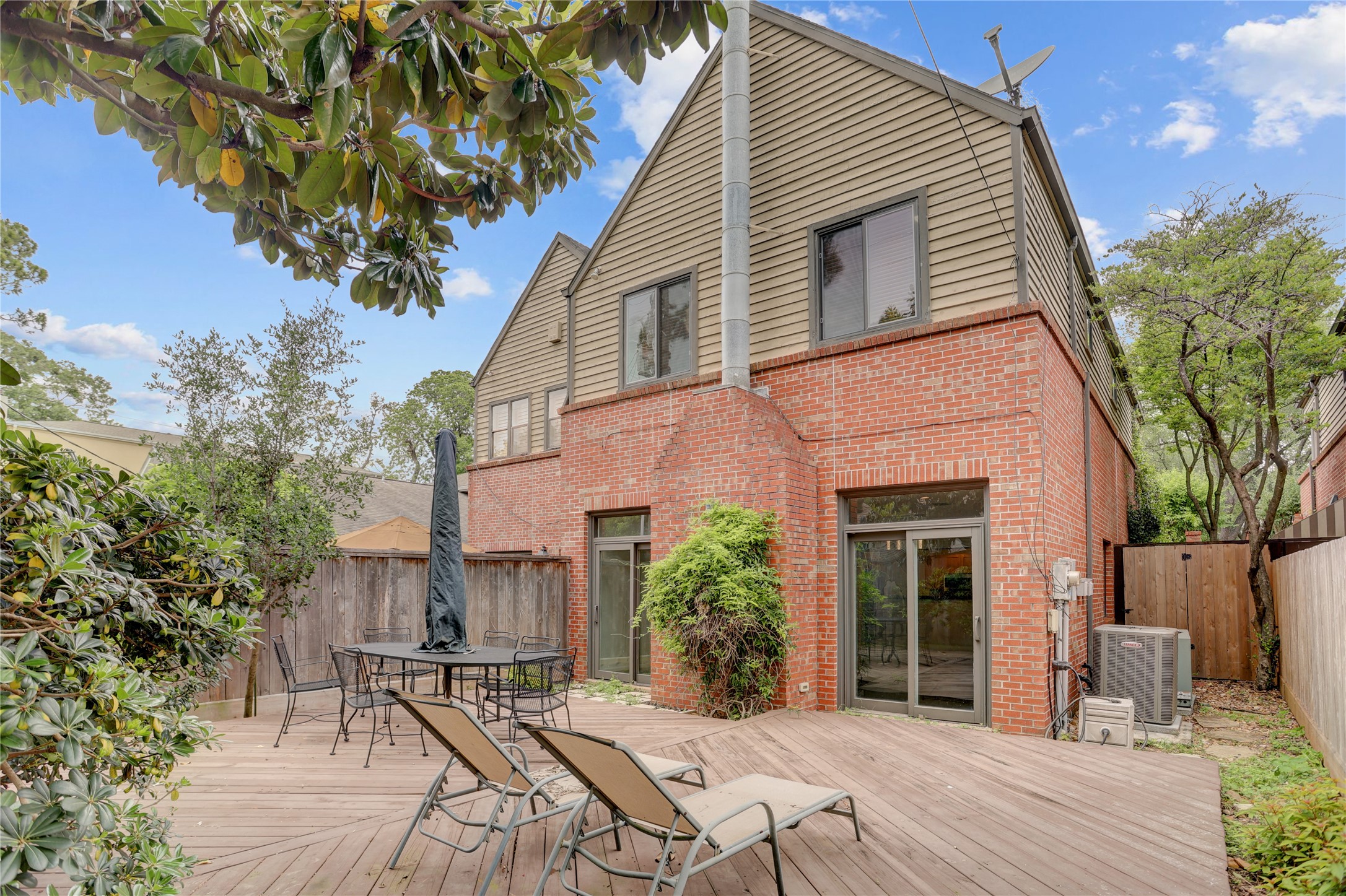 2629 Wroxton Road, Unit A Houston, TX 77005 - Photo 20 of 22 The patio connects effortlessly to the home with dual sliding doors.