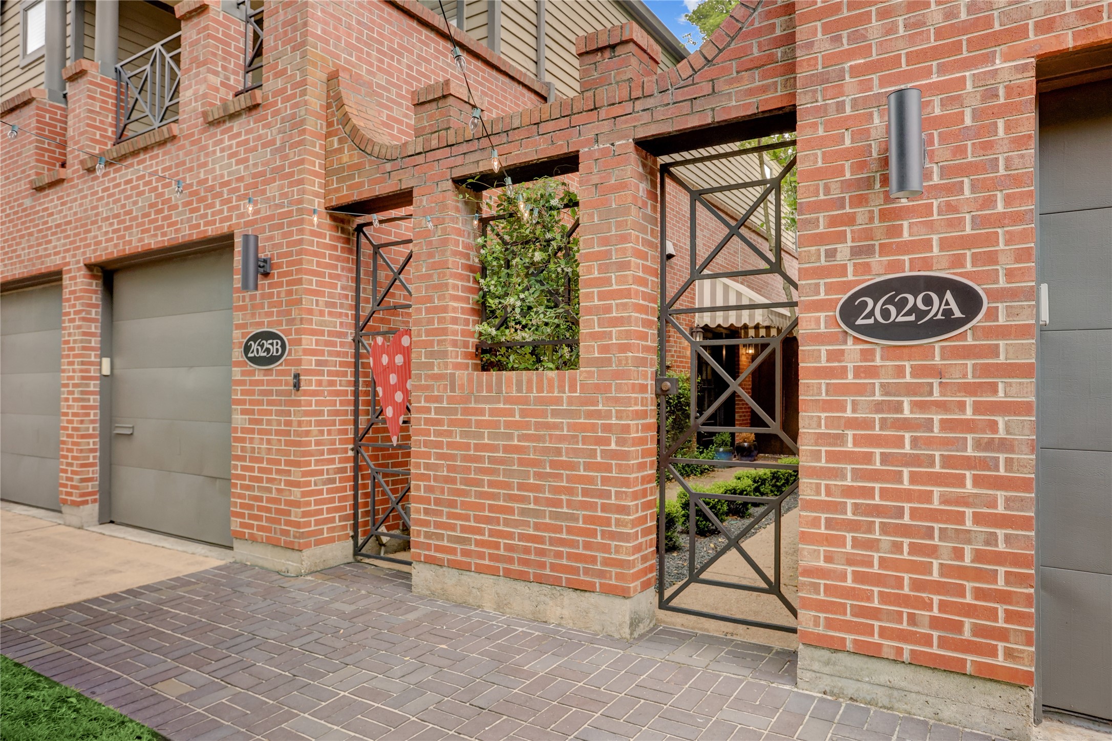 2629 Wroxton Road, Unit A Houston, TX 77005 - Photo 2 of 22 Gated entrance adds privacy and charm to this property.