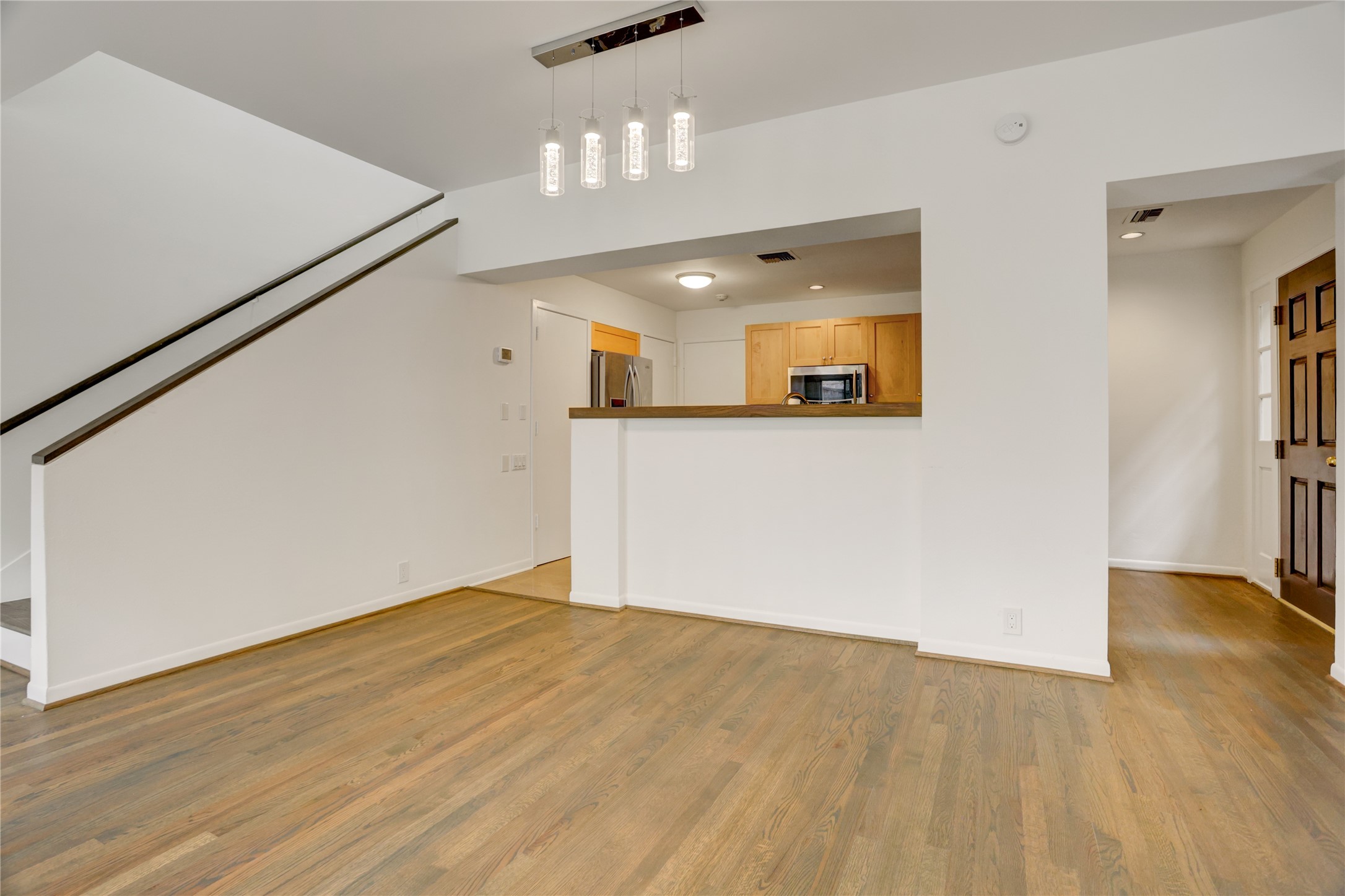 2629 Wroxton Road, Unit A Houston, TX 77005 - Photo 6 of 22 The bar creates a cozy connection between the kitchen and living area.