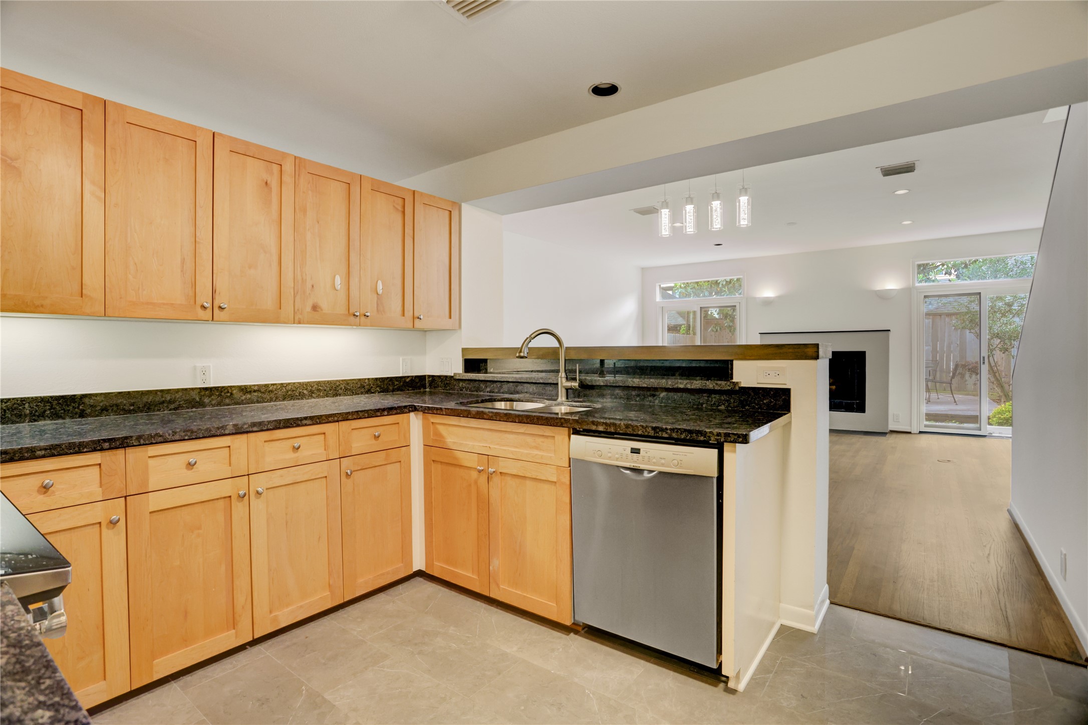 2629 Wroxton Road, Unit A Houston, TX 77005 - Photo 8 of 22 Prepare meals in the kitchen while enjoying views of the living room.