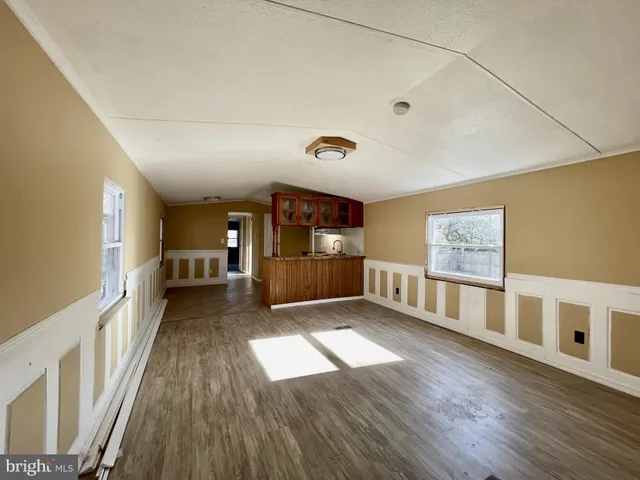 a view of gallery with wooden floor