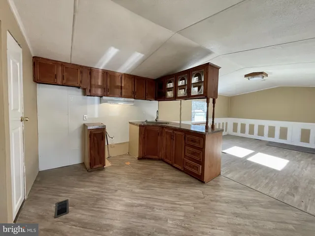 a view of a hallway with cabinet