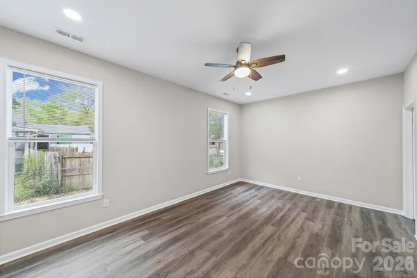 a view of a room with closet and wooden floors