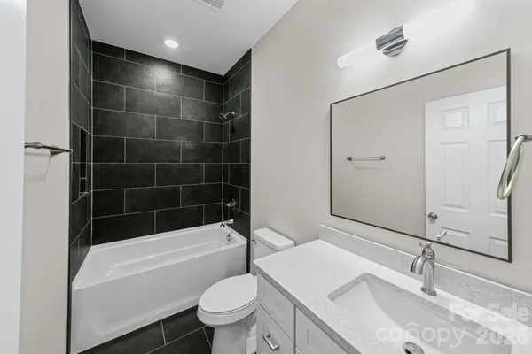 a bath tub sitting next to a shower