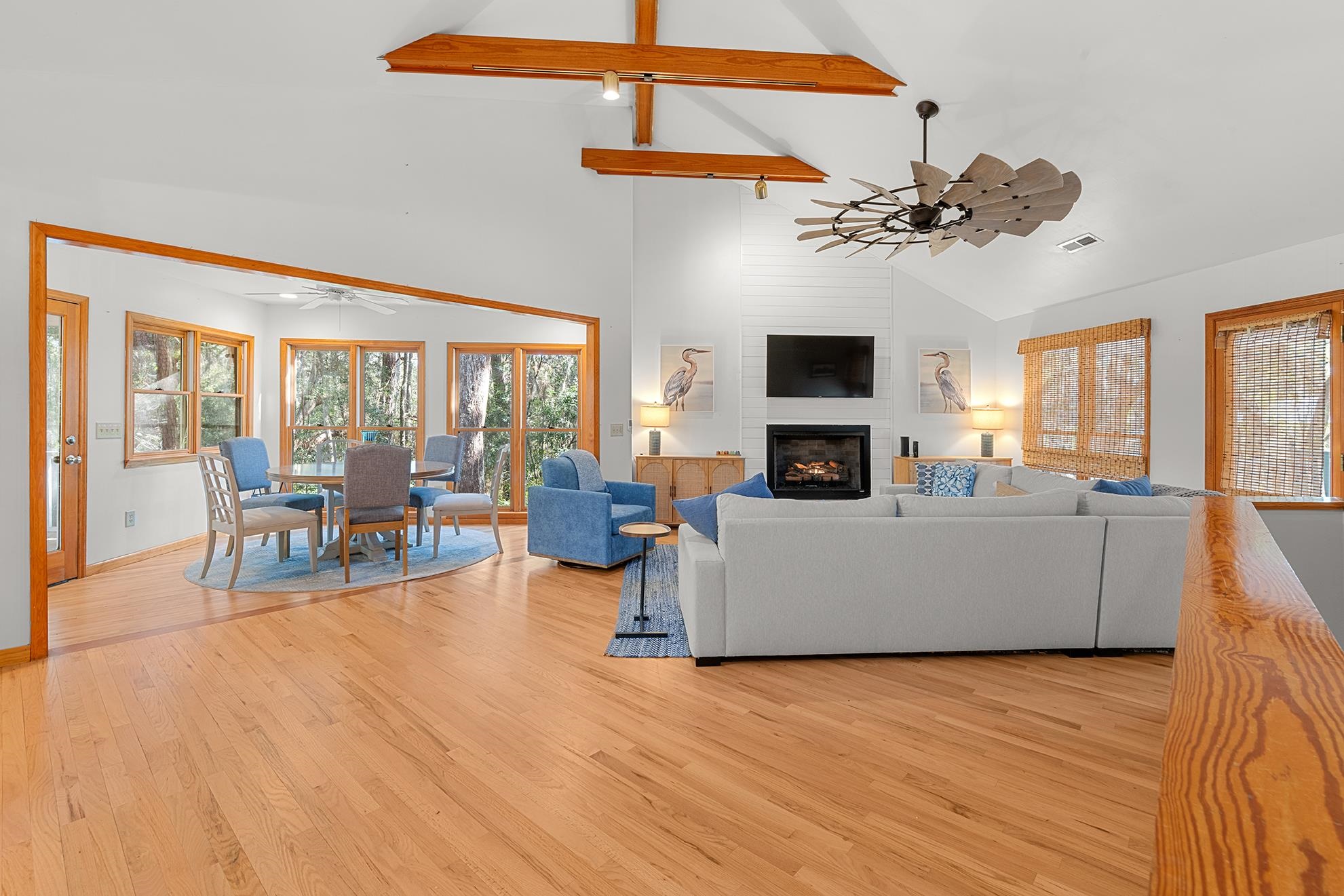 187 Alston Road Pawleys Island, SC 29585 - Photo 13 of 40 Living room with a ceiling fan, beam ceiling, high vaulted ceiling, light wood finished floors, and a fireplace
