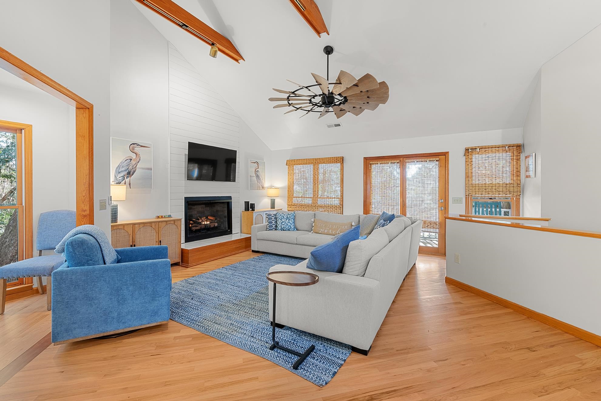 187 Alston Road Pawleys Island, SC 29585 - Photo 14 of 40 Living area with a large fireplace, high vaulted ceiling, light wood-style floors, and ceiling fan