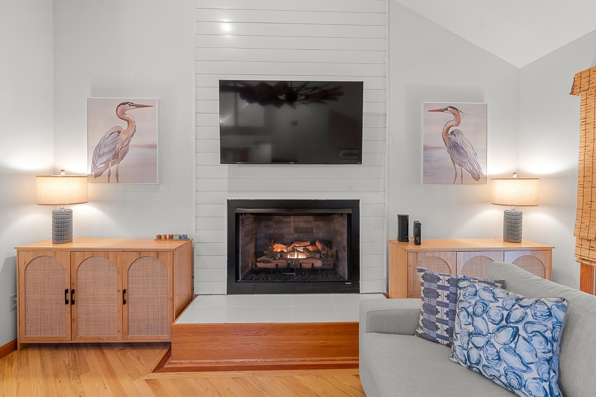 187 Alston Road Pawleys Island, SC 29585 - Photo 15 of 40 Living room featuring a fireplace, vaulted ceiling, and wood finished floors