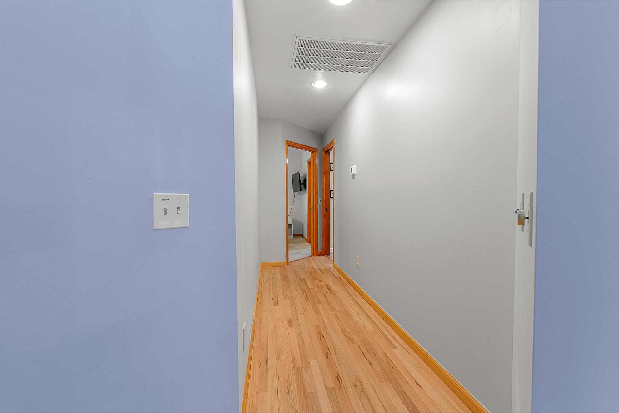 187 Alston Road Pawleys Island, SC 29585 - Photo 32 of 40 Corridor with light wood-style flooring and recessed lighting