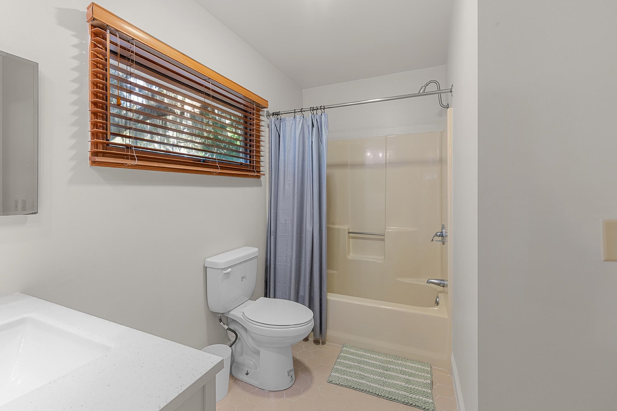 187 Alston Road Pawleys Island, SC 29585 - Photo 36 of 40 Bathroom with shower / bath combination with curtain, vanity, and light tile patterned flooring