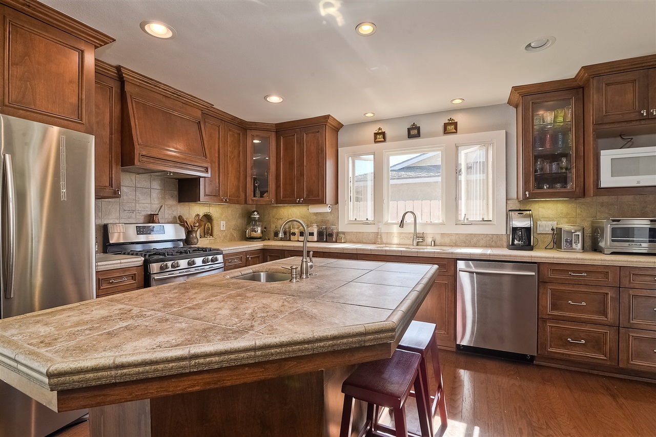4034 Pala Road Oceanside, CA 92057 - Photo 11 of 22 Kitchen with Custom Cabinetry with tons storage and Stainless Steel Appliances.