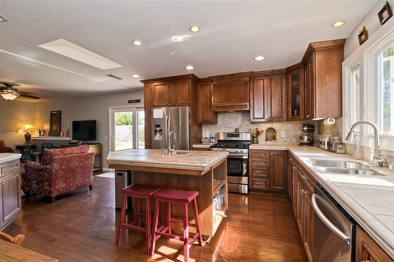 4034 Pala Road Oceanside, CA 92057 - Photo 10 of 22 Kitchen with Beautiful Custom Tile Counters and Wood Flooring.