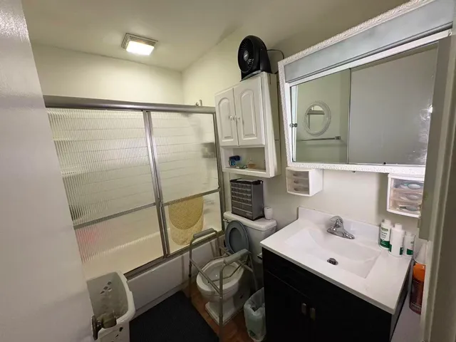 a bathroom with a sink and mirror