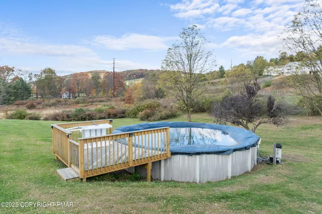 a kitchen with refrigerator a stove a sink and chairs