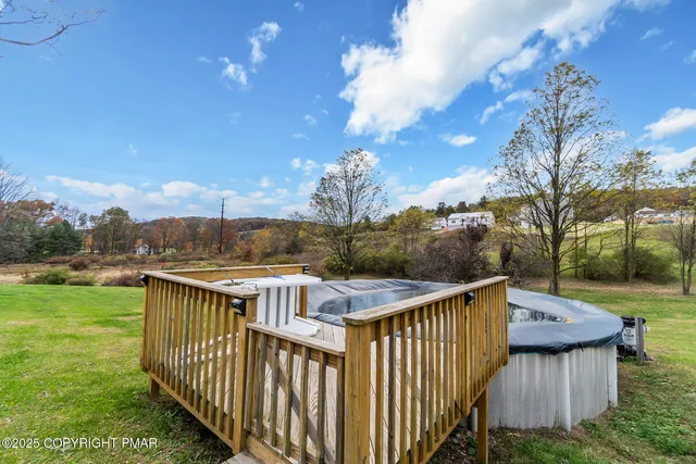 a kitchen with kitchen island granite countertop a sink appliances and cabinets