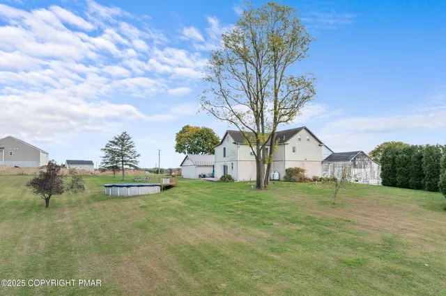 a view of a livingroom with a window and a fireplace