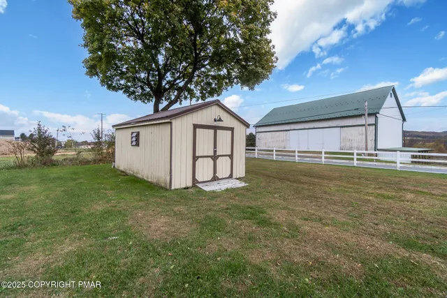 a living room with furniture a rug and a window
