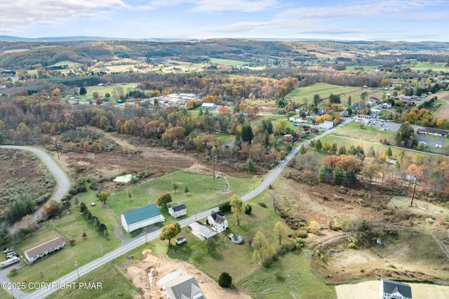 a bed room with a bed and a chair