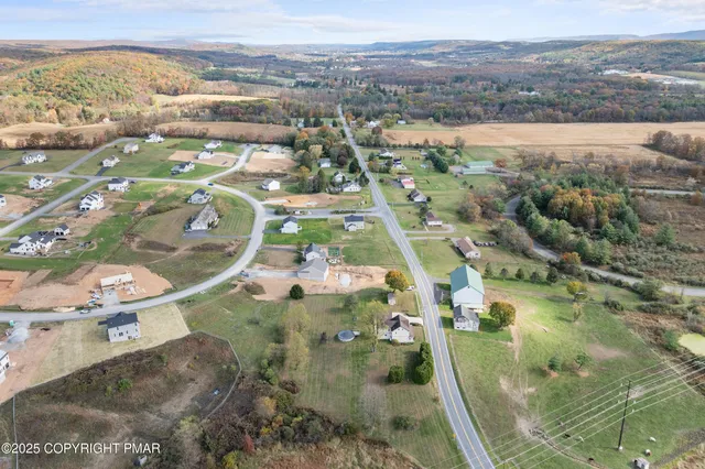 a living room filled with furniture and a wooden floor