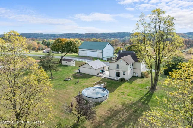 a view of a livingroom with furniture and a flat screen tv