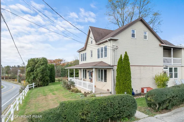 a view of a backyard of the house