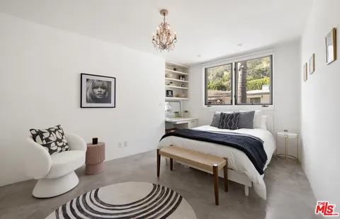 a bed room with a bed and a couch