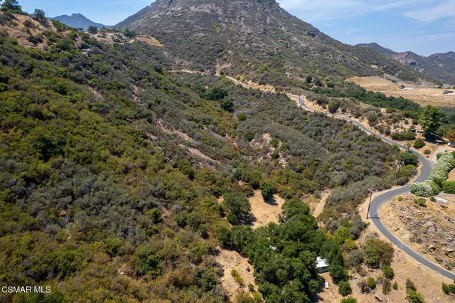 view of a mountain range with trees