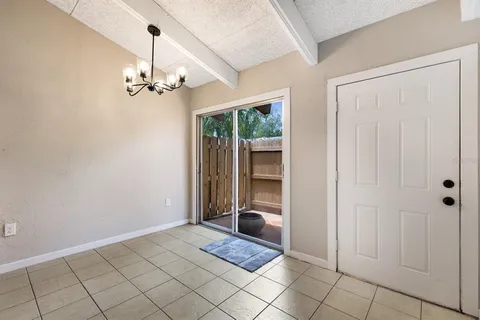 a view of a hallway with a chandelier