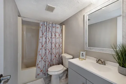 a view of an empty room with glass door