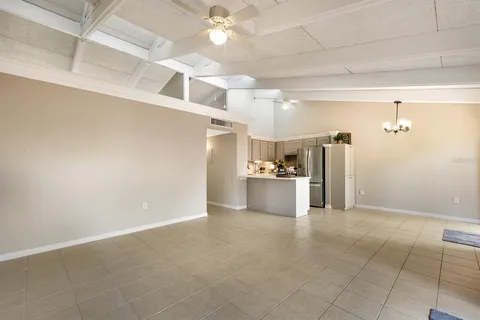 a view of a kitchen with a sink and cabinets