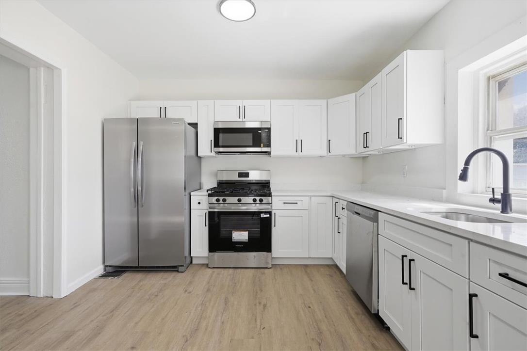 812 Linden Street Bethlehem, PA 18018 - Photo 7 of 39 A well-appointed kitchen features stainless steel appliances, clean white cabinetry, and durable flooring.