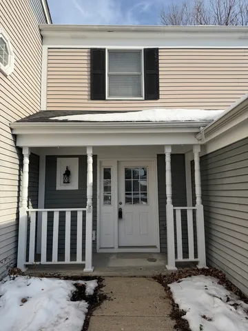 a view of a house with wooden fence
