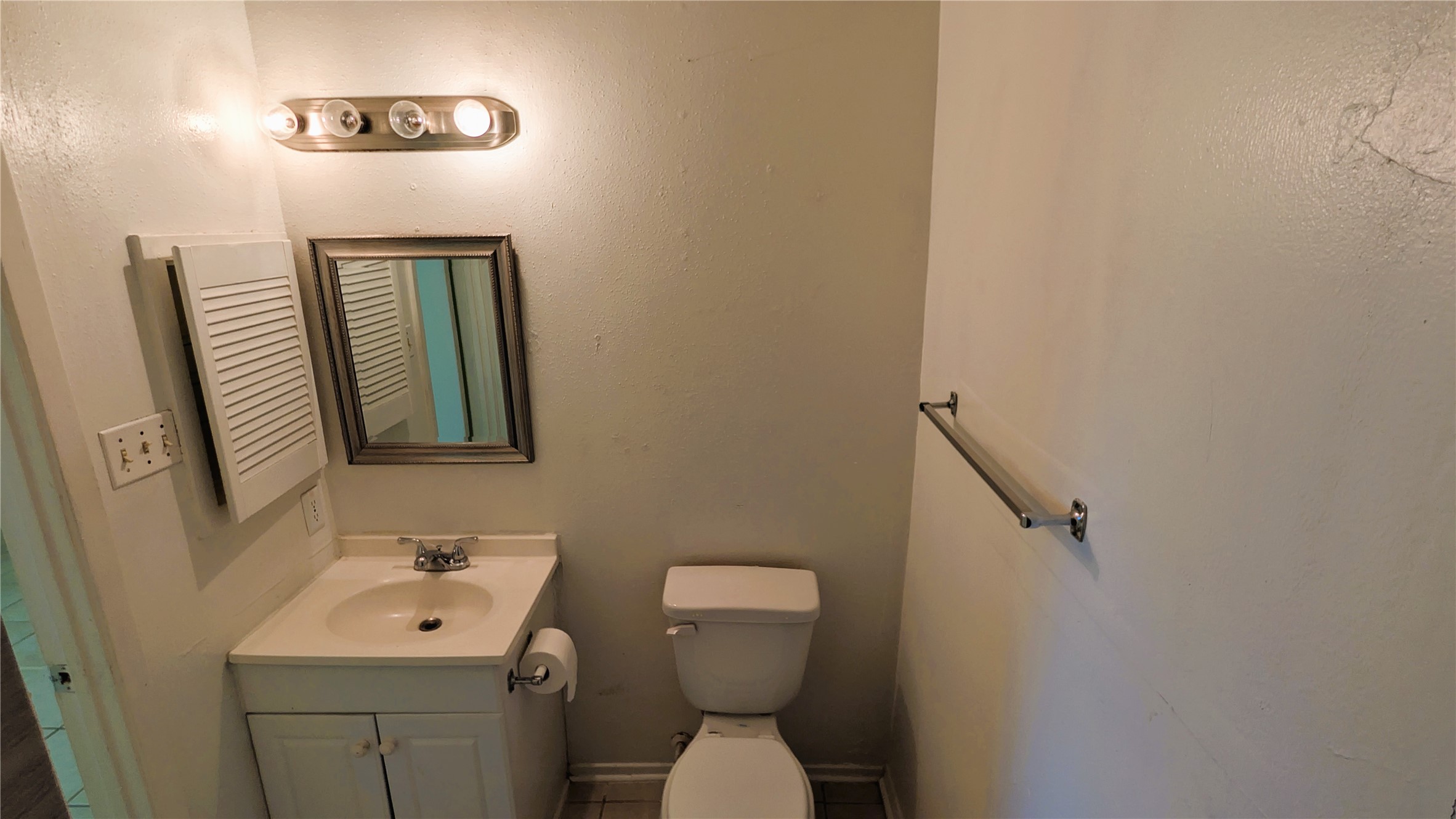 11403 Spring Grove Drive Houston, TX 77099 - Photo 13 of 23 a bathroom with a toilet sink and mirror
