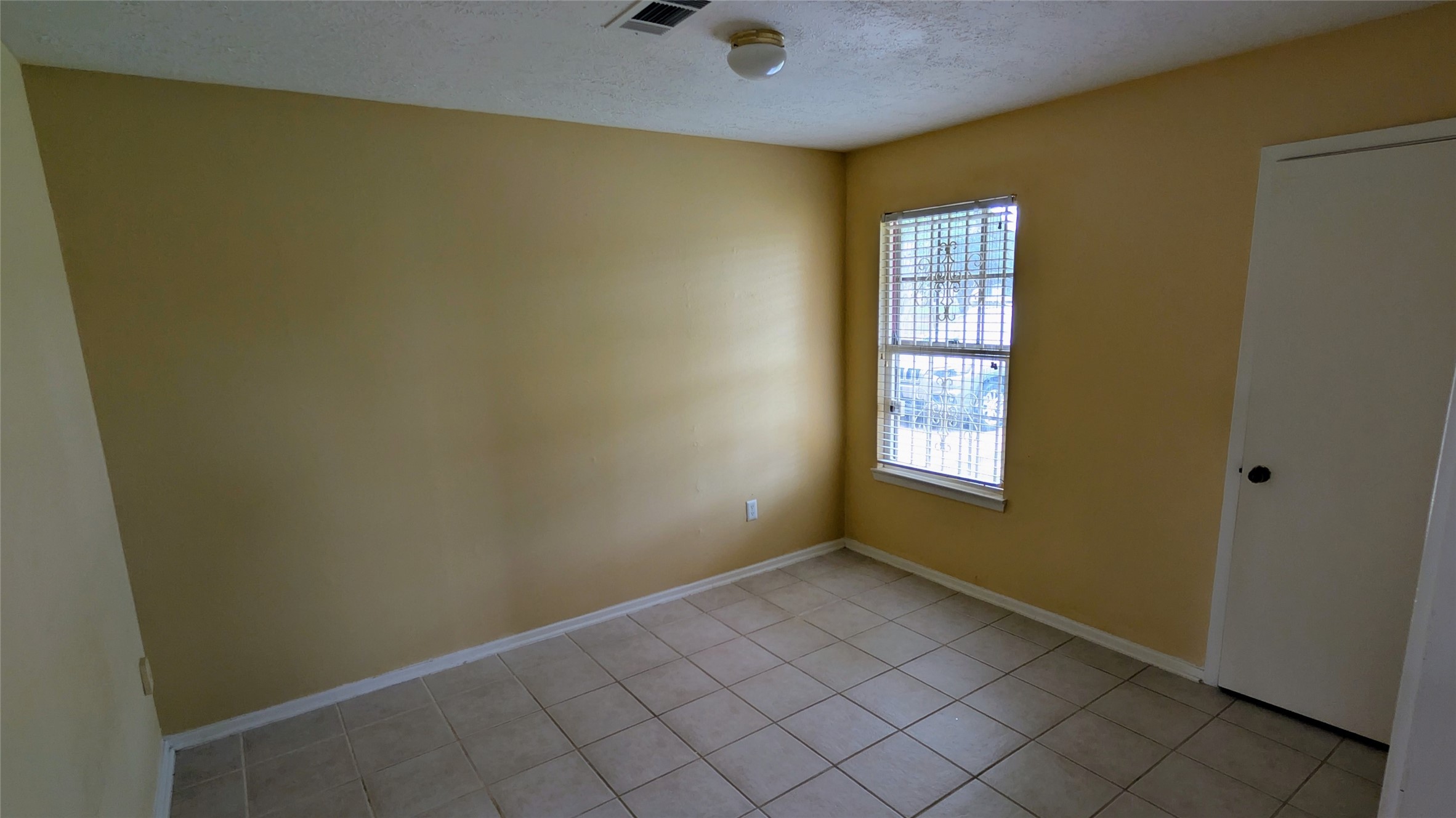 11403 Spring Grove Drive Houston, TX 77099 - Photo 14 of 23 a view of an empty room with window