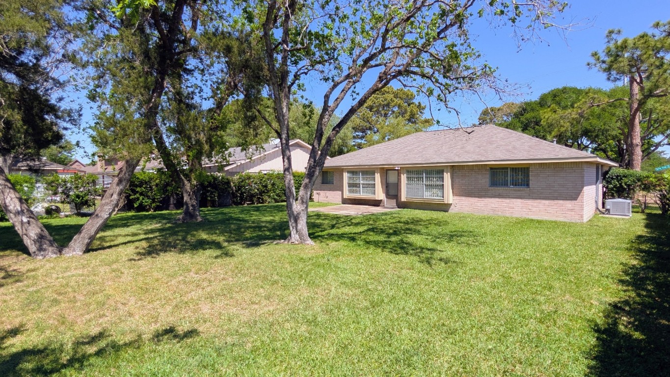 11403 Spring Grove Drive Houston, TX 77099 - Photo 21 of 23 a view of a house with a yard