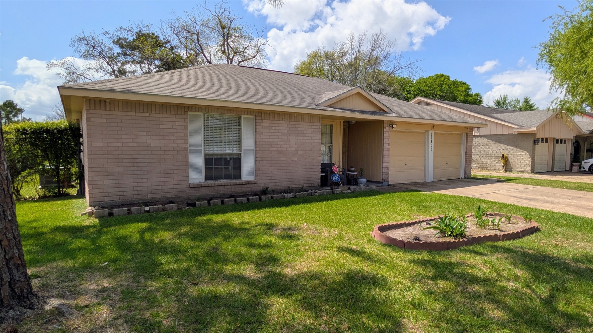 11403 Spring Grove Drive Houston, TX 77099 - Photo 3 of 23 a view of a house with a yard