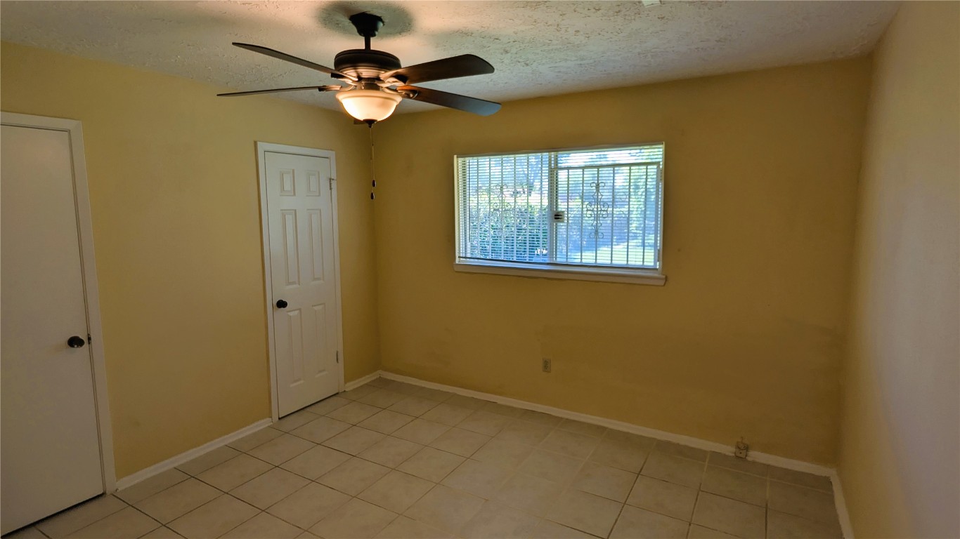 11403 Spring Grove Drive Houston, TX 77099 - Photo 10 of 23 a view of an chandelier fan and a chandelier fan