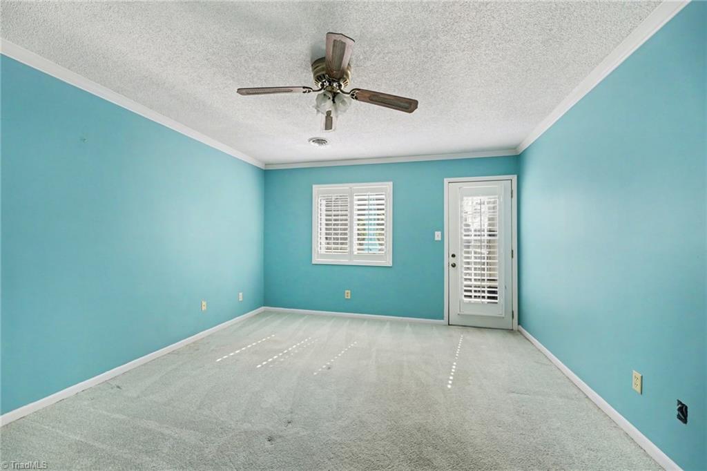 2313 Cypress Court High Point, NC 27265 - Photo 18 of 26 Primary bedroom on 2nd level. Plantation shutters and access to a private deck.