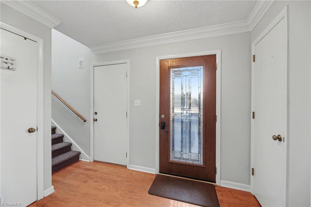 2313 Cypress Court High Point, NC 27265 - Photo 3 of 26 Entry has engineered Hardwood and gorgeous custom door.